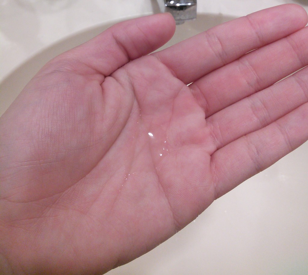 Hada Labo Gokujyun lotion dispensed into hand