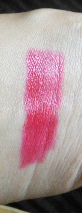 Arm swatch of Innisfree Creamy Tint lipstick in Refreshing Vitamin Red