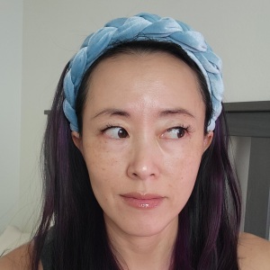 Fiddy with no filter and no makeup, showing the effects of her oil gritting method to unclog pores