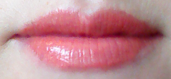 Lip swatch of Memebox Pony Blossom lipstick in Orange Dahlia