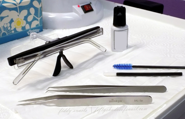 Tools for applying eyelash extensions.
